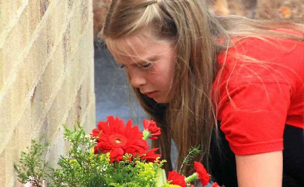 SAD OCCASION: Family and friends laid wreaths at the Memorial Wall. SAD OCCASION: Family and friends laid wreaths at the Memorial Wall.